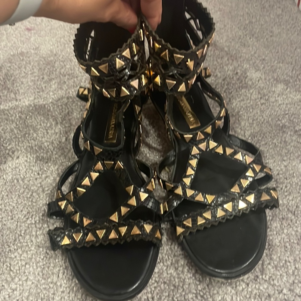 BCBGMaxAzria black and gold gladiator sandals